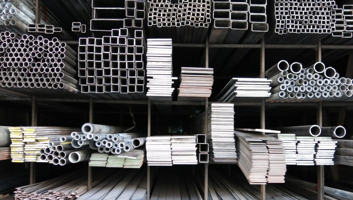 BMT - Blog 2 Shelves filled with round, square, and rectangular pipes of various steel tubing sizes.